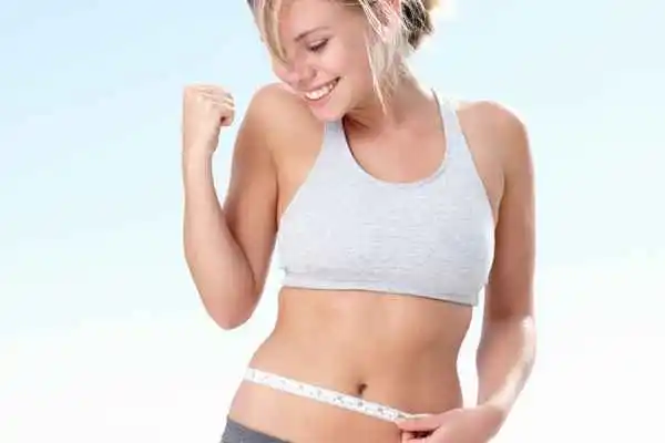 woman happy after fat reduction treatment Bridgend